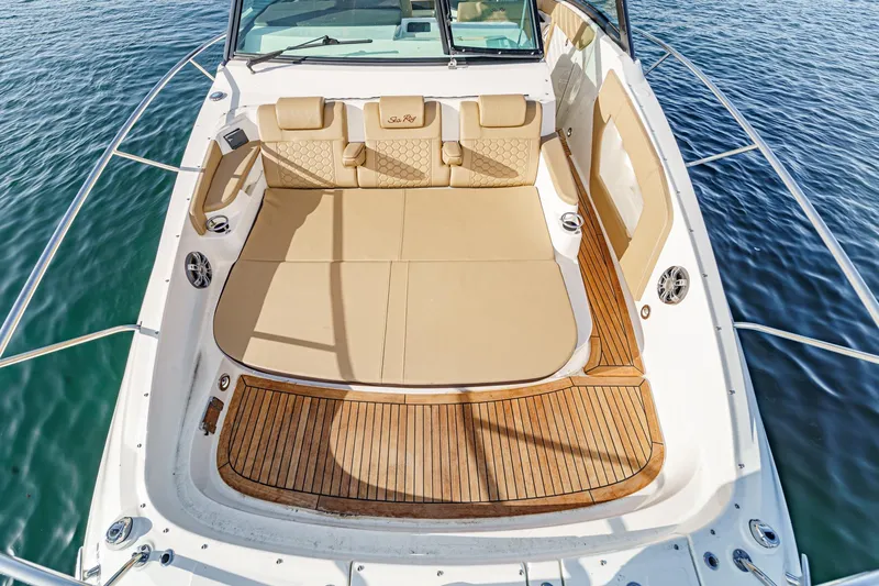 Slide: The Image of 2023 Sea Ray Sundancer 320 OB boat with spacious deck and luxurious seating. - 9