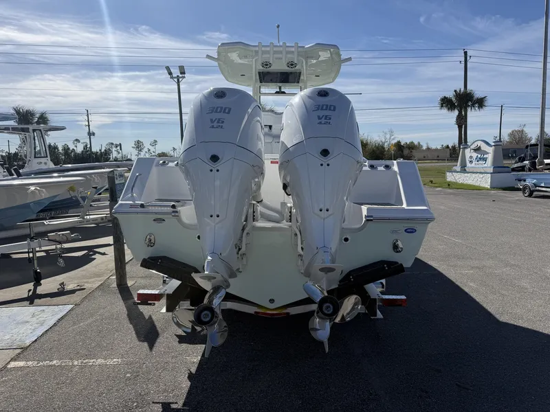 Slide: The Image of Rear view of 2026 Tidewater 282 CC Adventure with twin outboard engines. - 3