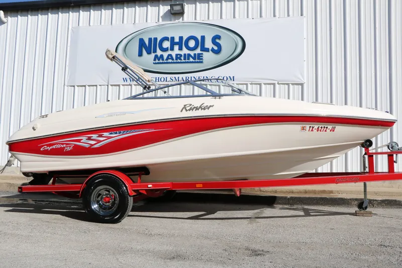 The Image of 2002 Rinker Captiva 192 Liberty Edition boat on trailer. - 1