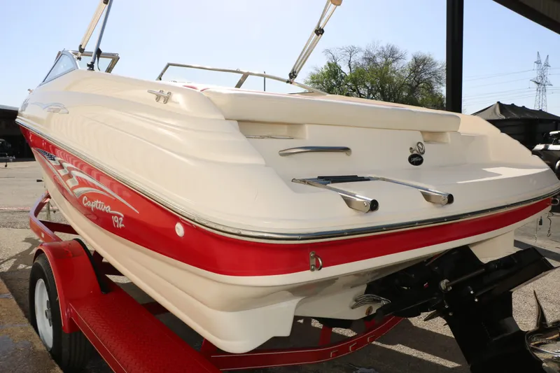 Slide: The Image of 2002 Rinker Captiva 192 Liberty Edition boat on trailer. - 10