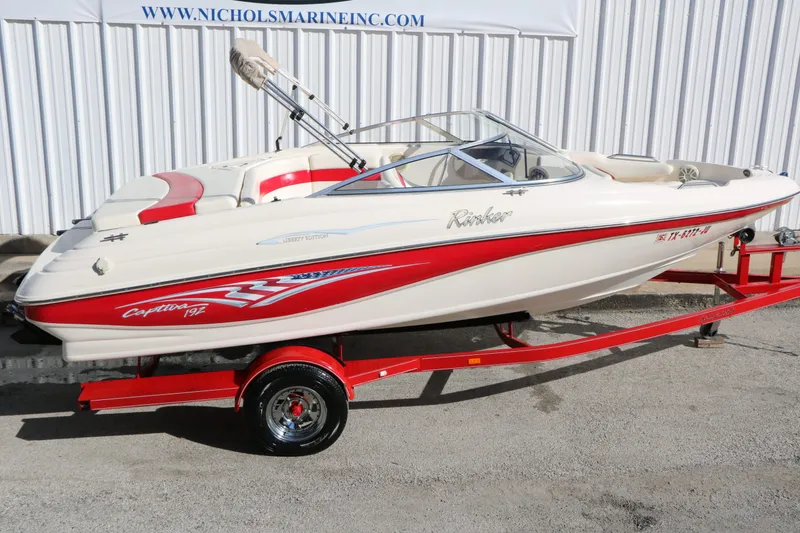 Slide: The Image of 2002 Rinker Captiva 192 Liberty Edition on red trailer. - 12