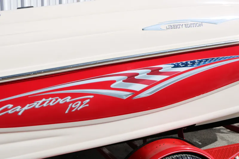 Slide: The Image of Rinker Captiva 192 Liberty Edition boat, 2002 model, featuring patriotic design. - 14
