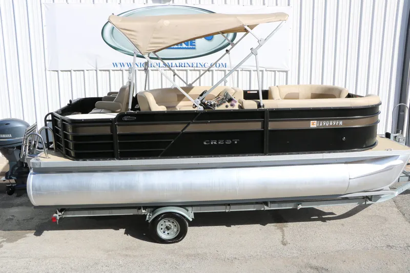 Slide: The Image of 2020 Crest 200 Classic Fish pontoon boat with canopy on trailer. - 10