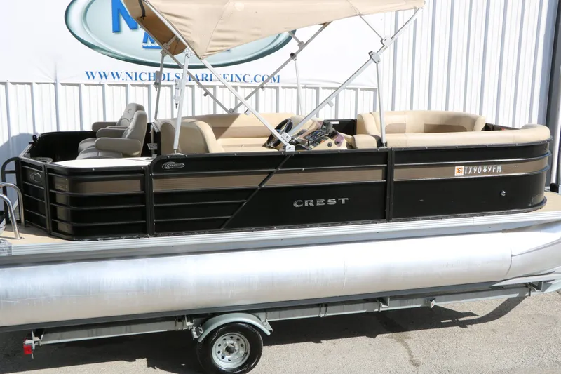 Slide: The Image of 2020 Crest 200 Classic Fish pontoon boat with canopy and beige seating. - 12