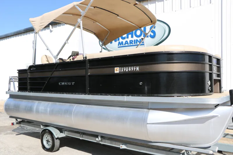 Slide: The Image of 2020 Crest 200 Classic Fish pontoon boat with canopy on trailer. - 3
