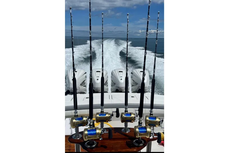 Slide: The Image of 2019 Regulator 41 boat with fishing rods and powerful outboard engines. - 11