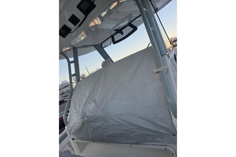 Slide: The Image of 2019 Regulator 41 boat interior with covered console and overhead electronics. - 14