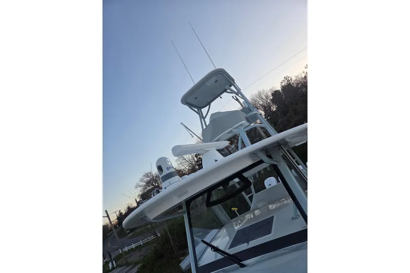 Slide: The Image of 2019 Regulator 41 boat with radar and antennas against a clear sky. - 16