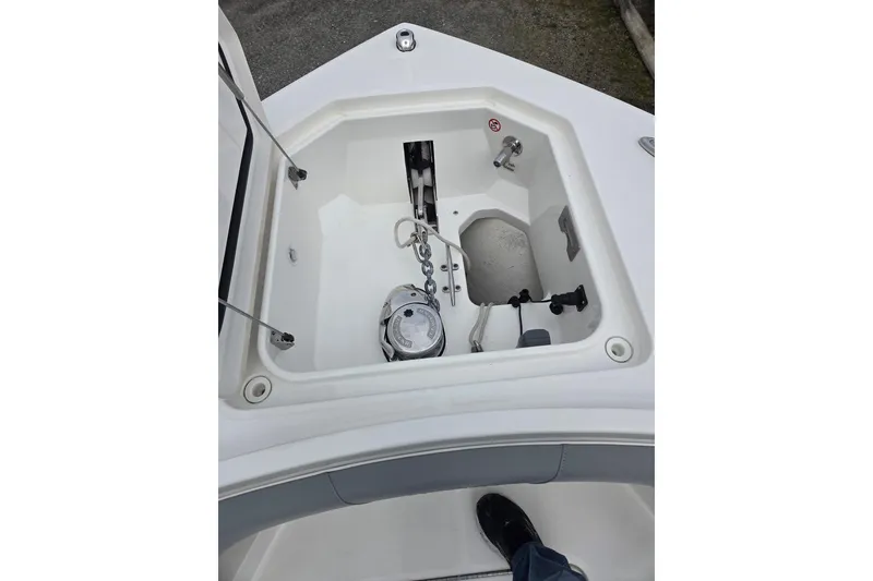 Slide: The Image of Anchor compartment of 2019 Regulator 41 boat, featuring chain and winch system. - 18
