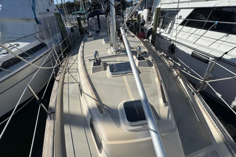 Slide: The Image of 1991 Island Packet Yachts 38 sailboat docked, showcasing deck and rigging details. - 19