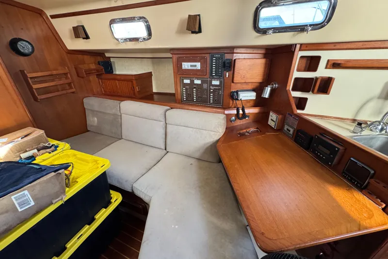 Slide: The Image of Interior of 1991 Island Packet Yachts 38 with navigation station and seating area. - 29