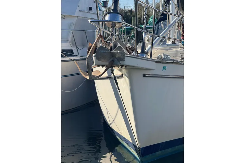 Slide: The Image of Bow of 1991 Island Packet Yachts 38 with anchor, docked in marina. - 5