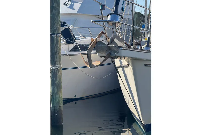Slide: The Image of 1991 Island Packet Yachts 38 sailboat with anchor at marina dock. - 6