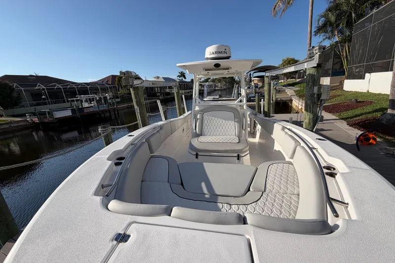 Slide: The Image of 2022 Sea Fox 288 Commander boat docked, featuring spacious seating and modern design. - 39