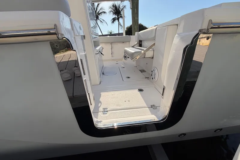 Slide: The Image of 2022 Sea Fox 288 Commander boat interior with seating and open deck view. - 42