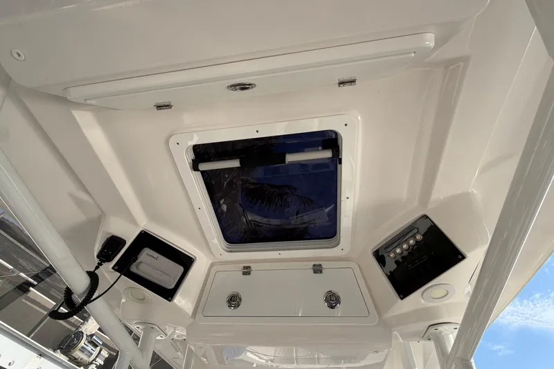Slide: The Image of Interior view of 2022 Sea Fox 288 Commander boat ceiling with hatch and controls. - 43