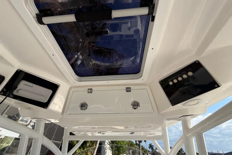 Slide: The Image of Interior view of 2022 Sea Fox 288 Commander boat, featuring control panel and hatch. - 44