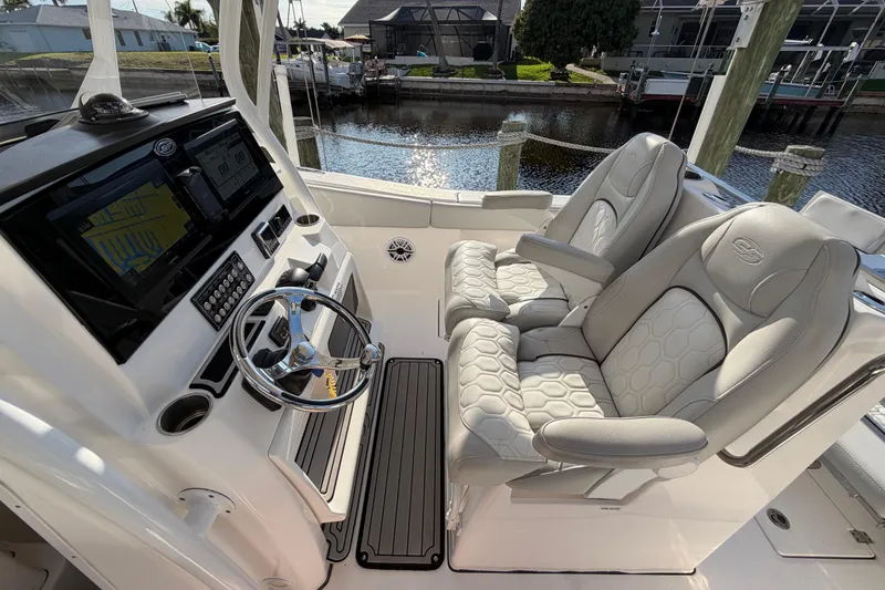 Slide: The Image of 2022 Sea Fox 288 Commander boat cockpit with dual seats and modern dashboard. - 46