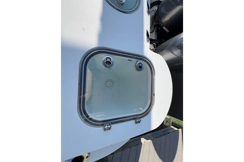 Slide: The Image of 2022 Sea Fox 288 Commander boat hatch with dual outboard motors. - 52