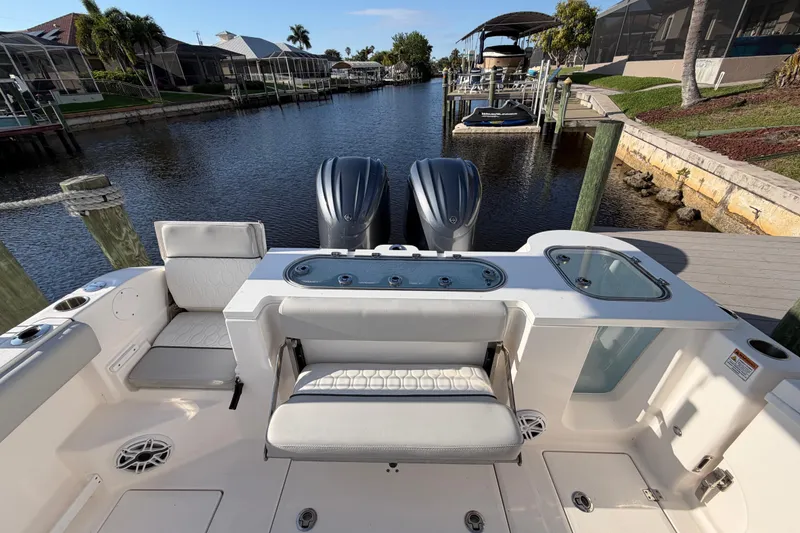 Slide: The Image of 2022 Sea Fox 288 Commander boat with dual engines docked in a scenic canal. - 53