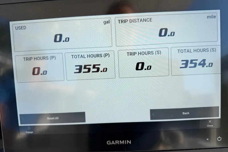 Slide: The Image of Garmin display showing Sea Fox 288 Commander engine hours and trip data. - 59