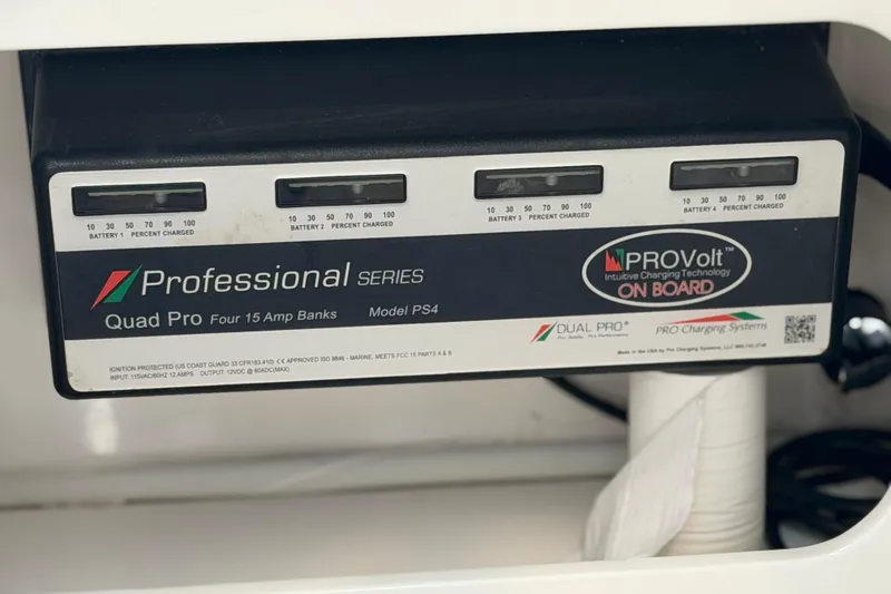 Slide: The Image of Battery charger display on 2022 Sea Fox 288 Commander boat, showing charge levels for four batteries. - 60