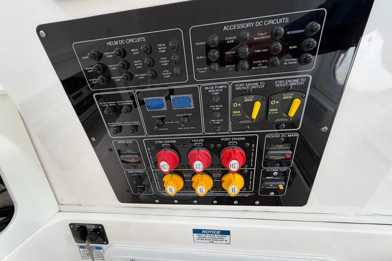 Slide: The Image of Control panel of a 2022 Sea Fox 288 Commander boat with various switches and circuits. - 62