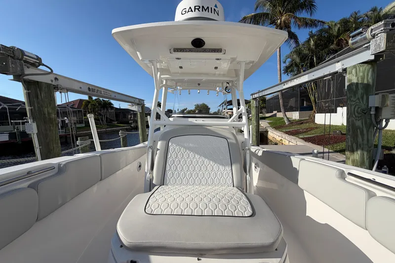 Slide: The Image of 2022 Sea Fox 288 Commander boat interior with seating and Garmin equipment. - 65