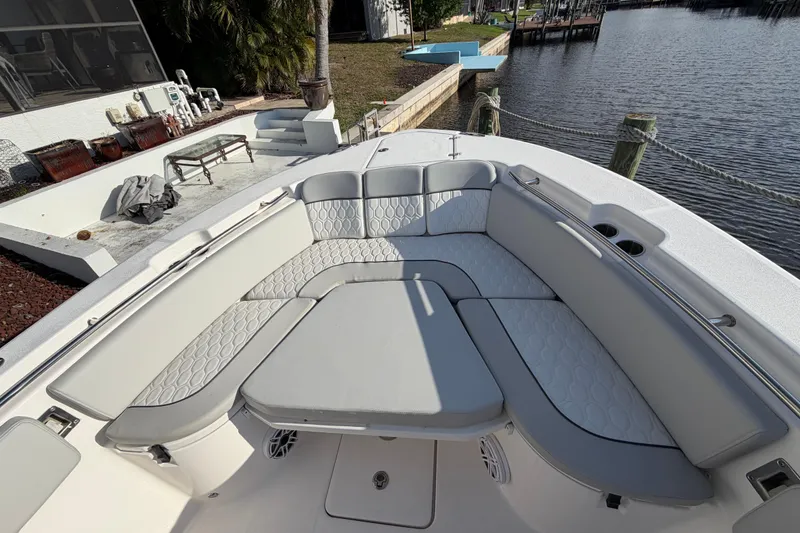 Slide: The Image of Luxurious seating area on 2022 Sea Fox 288 Commander boat by the water. - 66