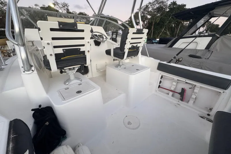 Slide: The Image of 2006 Century 2400 Walk-Around boat interior with seating and storage compartments. - 10