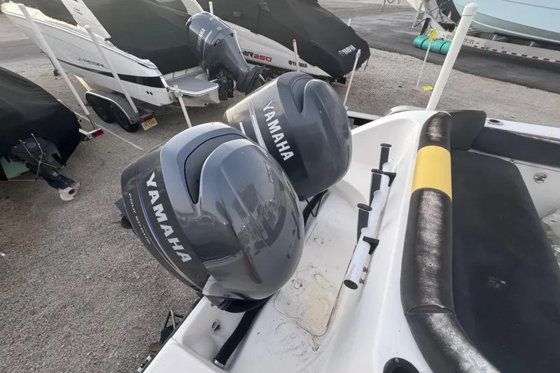 Slide: The Image of Two Yamaha outboard motors on a 2006 Century 2400 Walk-Around boat. - 2