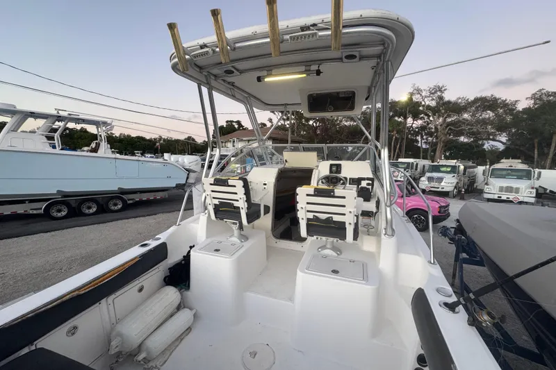 Slide: The Image of 2006 Century 2400 Walk-Around boat interior with seating and steering wheel. - 4