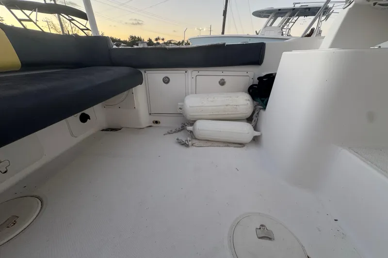 Slide: The Image of 2006 Century 2400 Walk-Around boat interior with seating and storage compartments. - 6