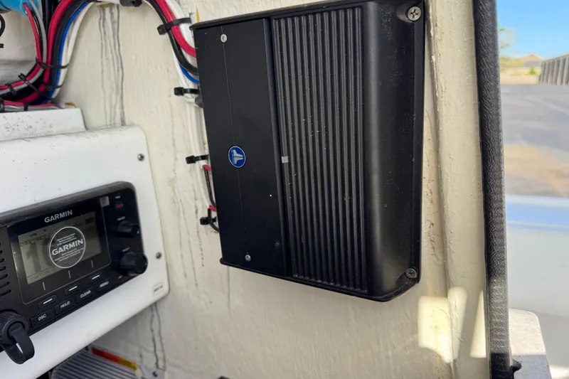 Slide: The Image of 2023 Contender 26 Bay boat electronics, featuring Garmin device and wiring setup. - 11