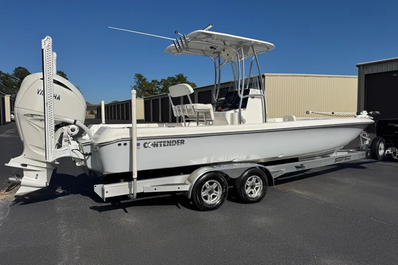 Slide: The Image of 2023 Contender 26 Bay boat on trailer, featuring Yamaha outboard motor. - 3