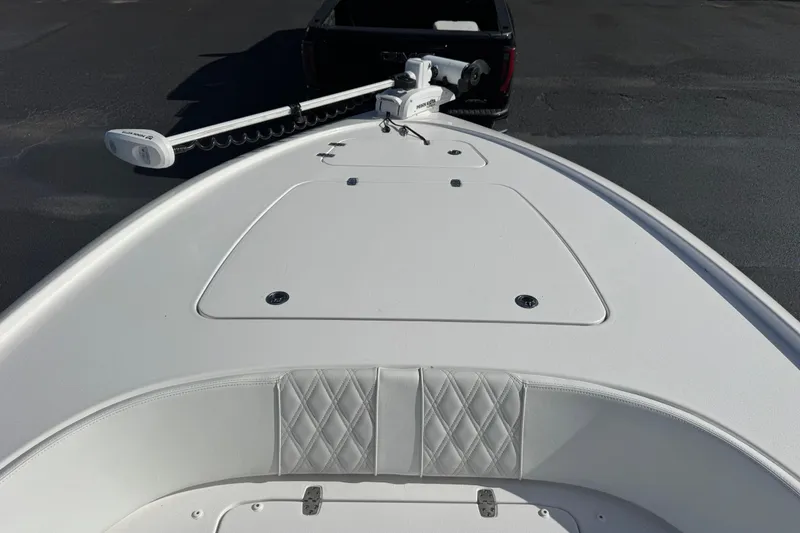Slide: The Image of 2023 Contender 26 Bay boat with trolling motor, viewed from the bow. - 6