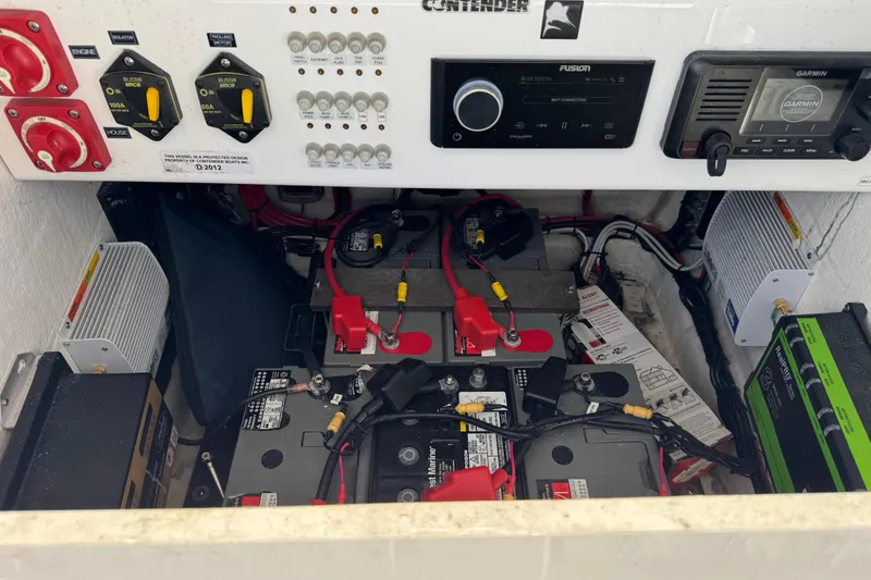Slide: The Image of Electrical system of 2023 Contender 26 Bay boat with batteries and control panel. - 9