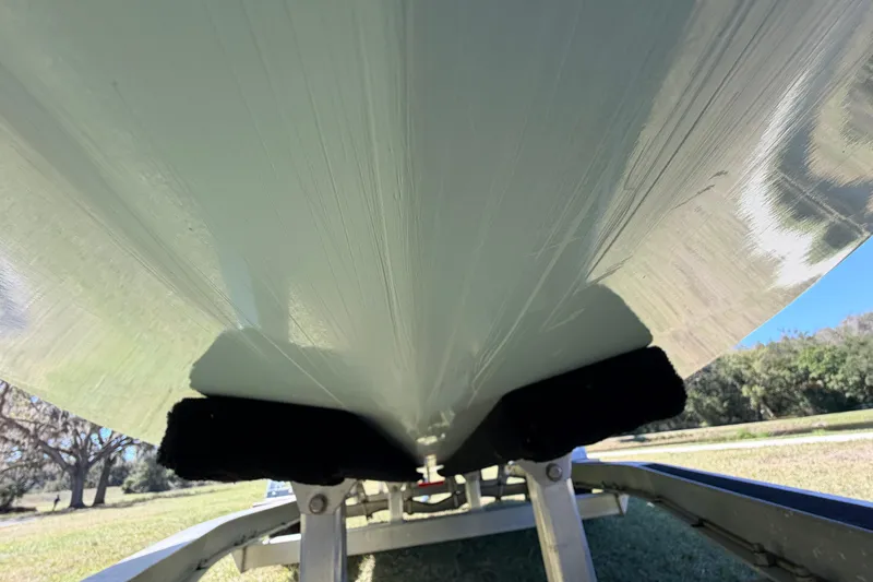 Slide: The Image of Underside view of 2023 East Cape 18 EVO X boat on trailer. - 10