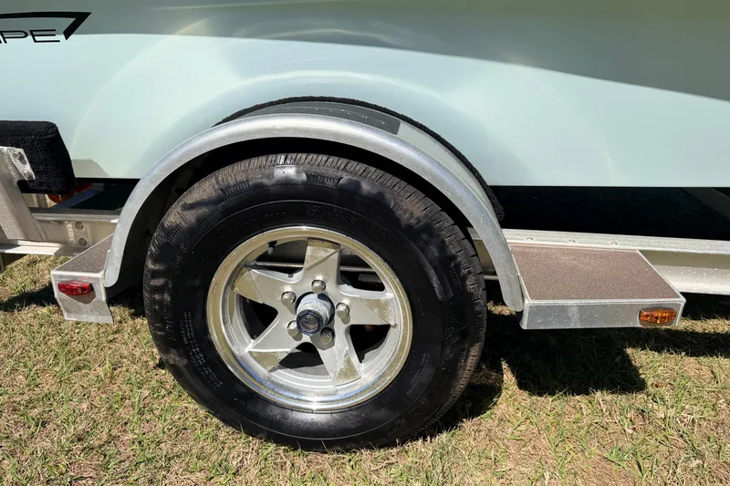 Slide: The Image of Trailer wheel of 2023 East Cape 18 EVO X on grass. - 16