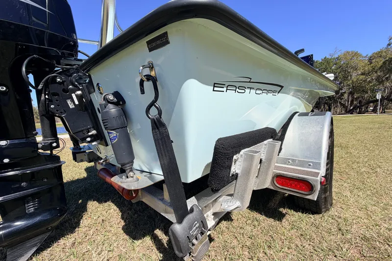 Slide: The Image of 2023 East Cape 18 EVO X boat on trailer, rear view, outdoors. - 17