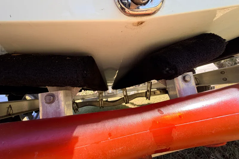 Slide: The Image of 2023 East Cape 18 EVO X boat trailer underside with red support beam. - 22