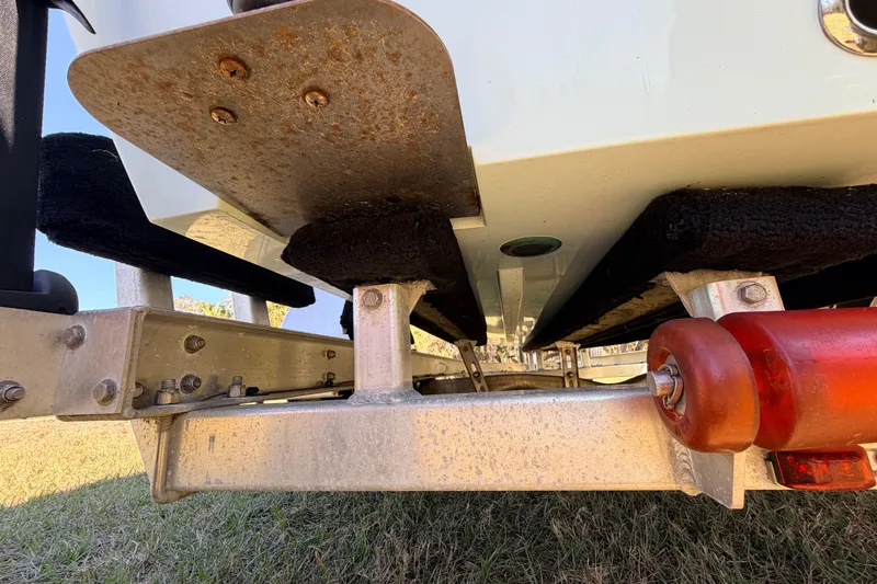 Slide: The Image of Trailer view of 2023 East Cape 18 EVO X boat, showing hull and support structure. - 23