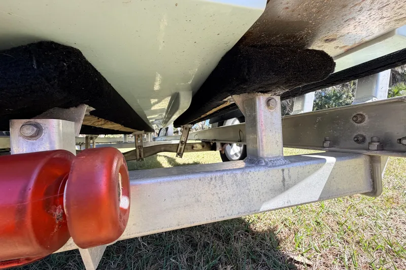Slide: The Image of Underneath view of 2023 East Cape 18 EVO X boat on trailer. - 24