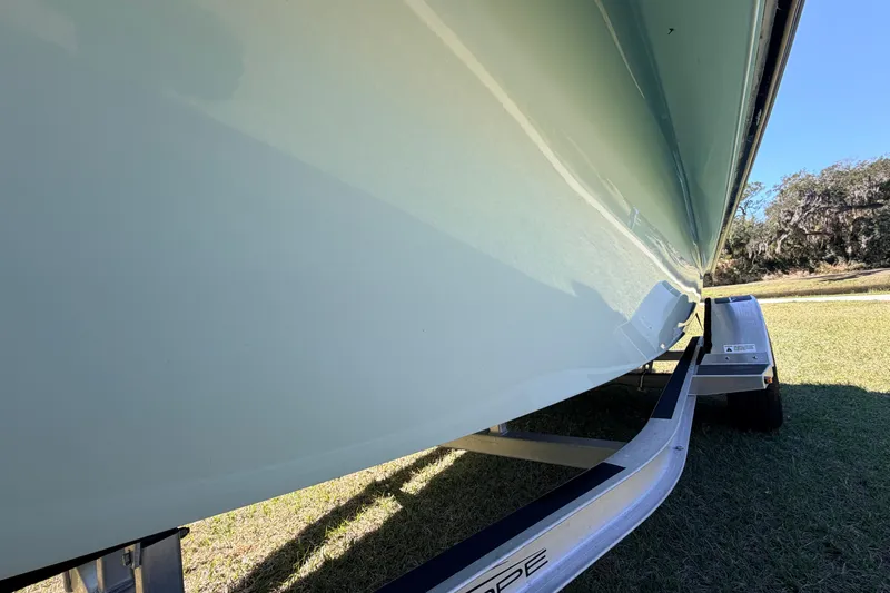 Slide: The Image of 2023 East Cape 18 EVO X boat on trailer, side view. - 28