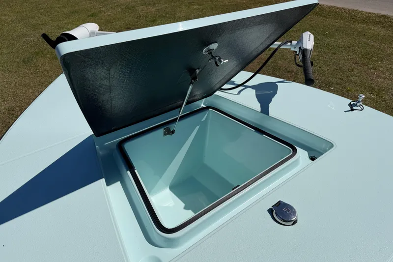 Slide: The Image of Open storage compartment on 2023 East Cape 18 EVO X boat deck. - 38