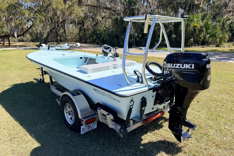 Slide: The Image of 2023 East Cape 18 EVO X boat with Suzuki outboard motor on trailer. - 4