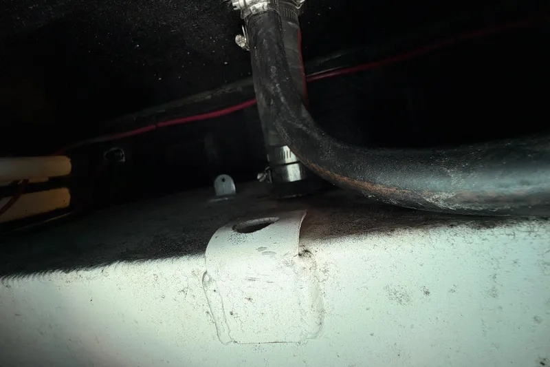 Slide: The Image of Close-up of East Cape 18 EVO X 2023 boat interior, showing hose and fittings. - 40