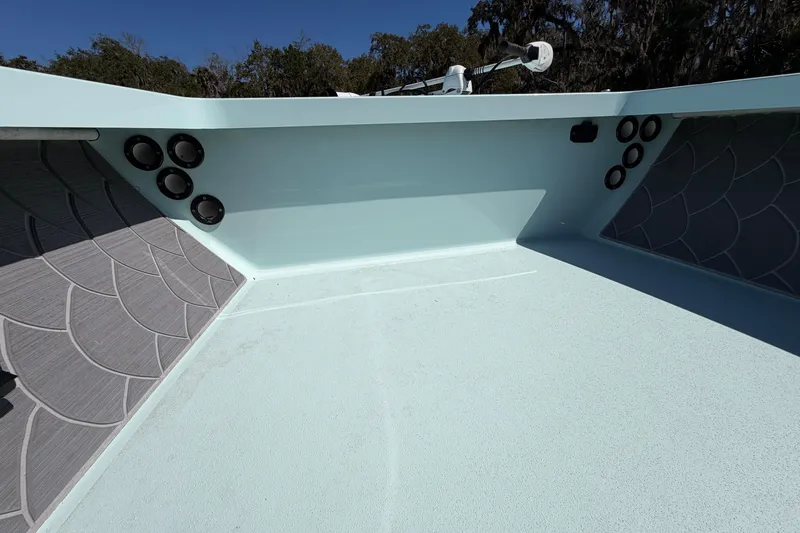 Slide: The Image of 2023 East Cape 18 EVO X boat interior with speakers and textured flooring. - 41