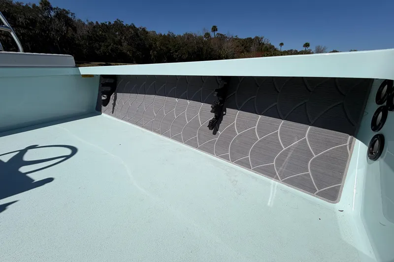 Slide: The Image of 2023 East Cape 18 EVO X boat interior with textured side panel and light blue deck. - 44