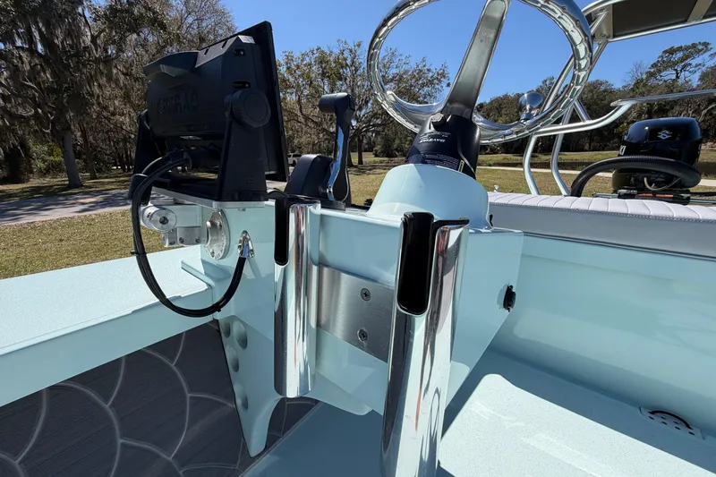 Slide: The Image of 2023 East Cape 18 EVO X boat console with steering wheel and electronics. - 45